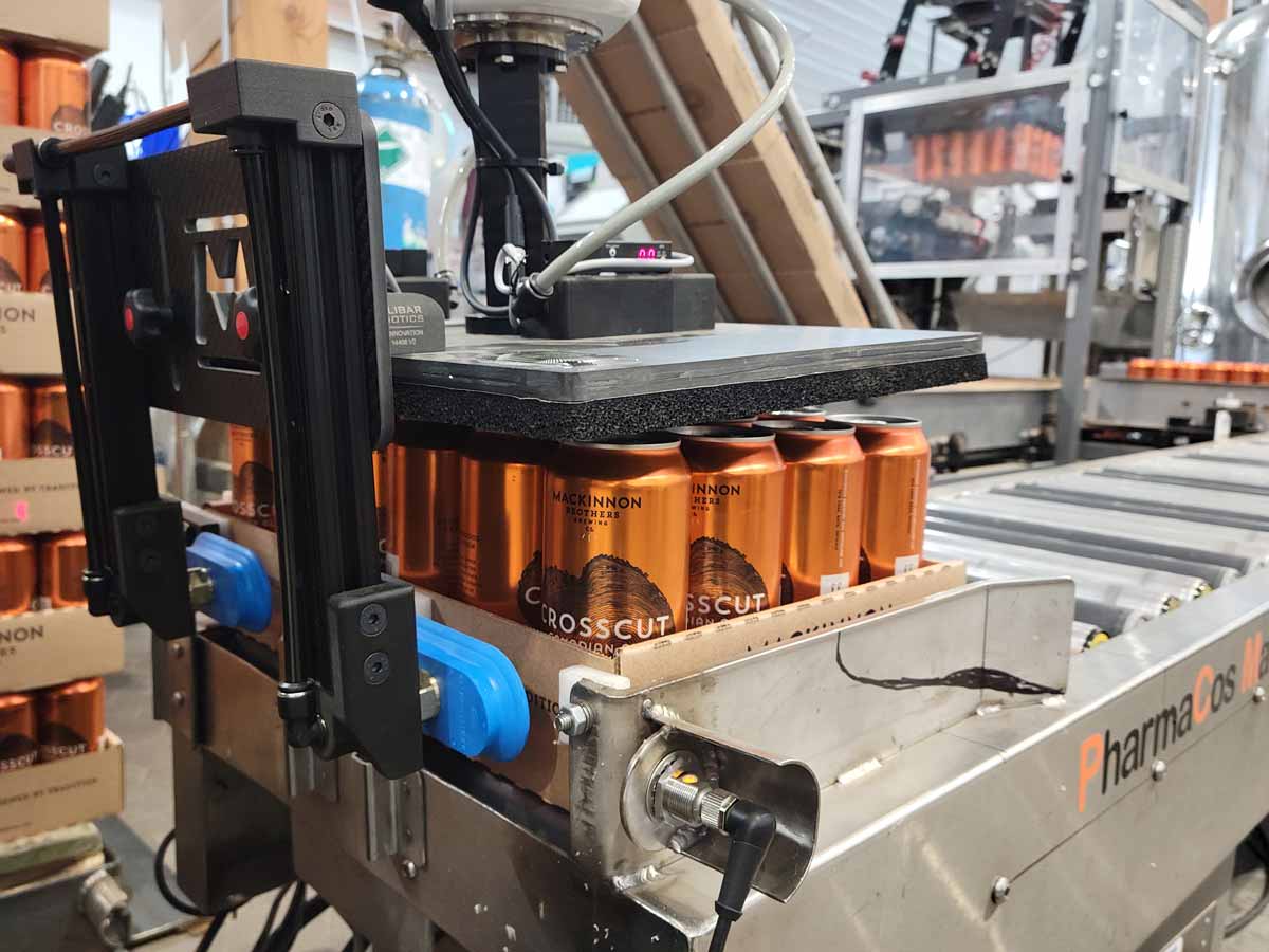 Featured image for “Hybrid Palletizing Gripper for 2 Different Can Sizes”